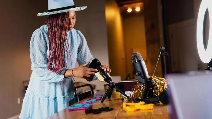 Gahmya Sets Up Her Desk With Microphones And A Ring Light. | Digital Learning