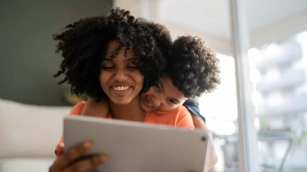 Mother And Son Enjoying The Benefits Of 5G Home Internet