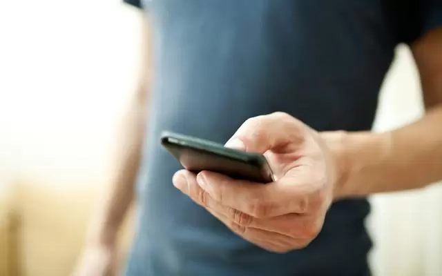 Close up of man using a smartphone