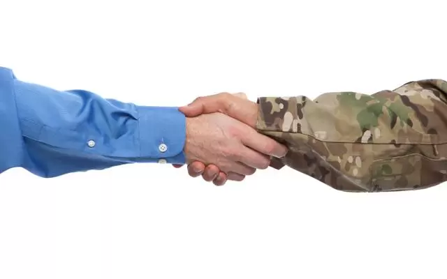 Businessman and military handshake