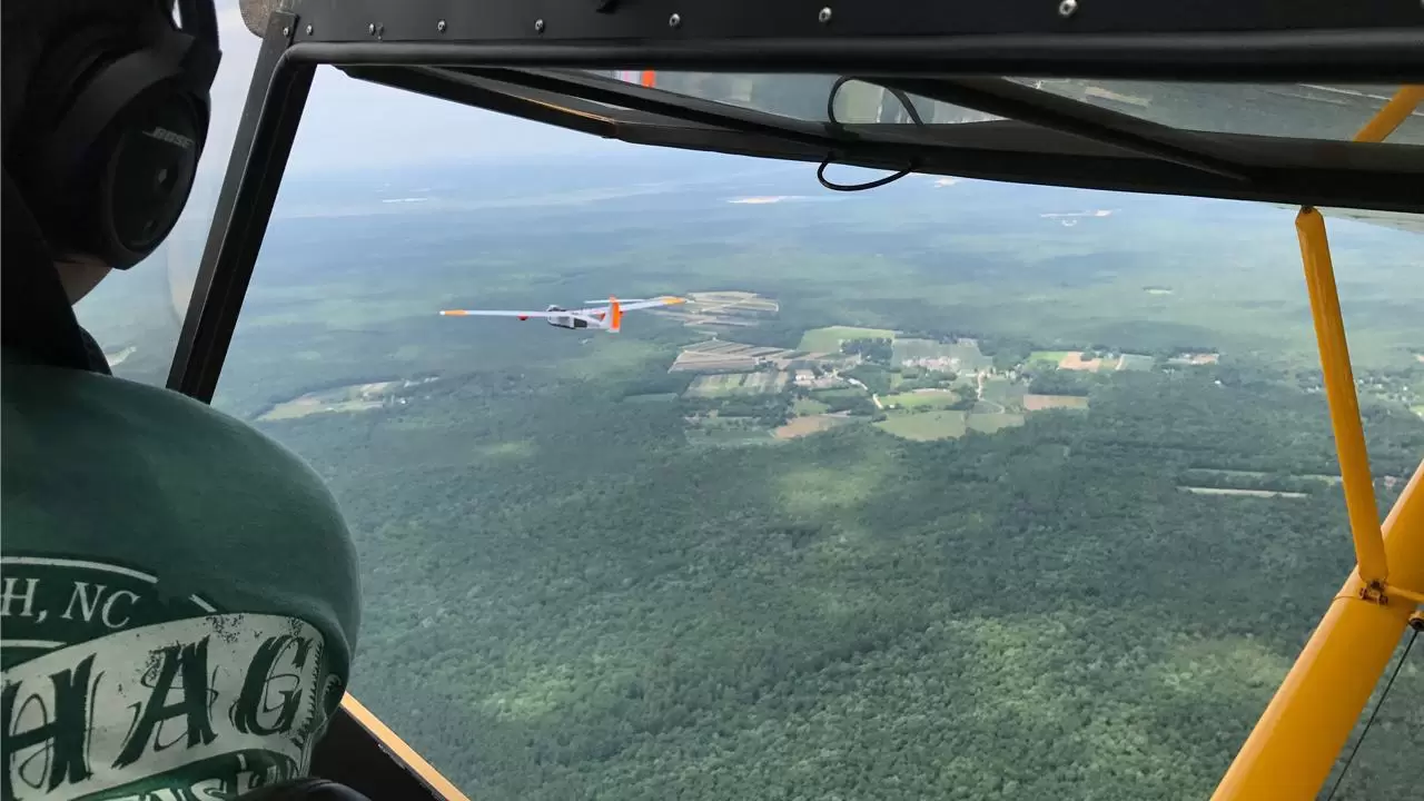 Chase plane follows drone